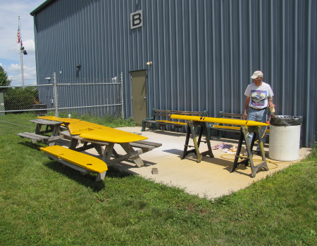 Finish paint being applied to a control surface
